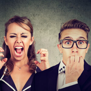 Angry Mad Woman Screaming And Fearful Stressed Man